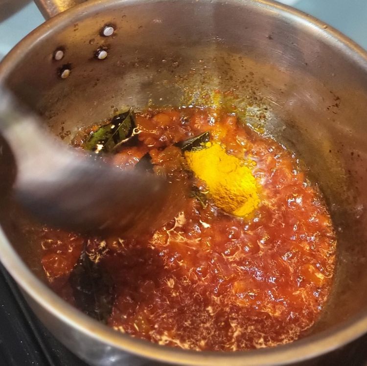 Step 1.2: Add the curry leaves, garam masala, cumin powder, turmeric, and chilli powder