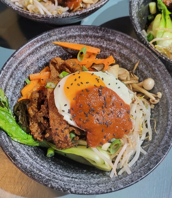 Step 1.1: Place the egg on top of the beef, & top with a dollop of the gochujang paste