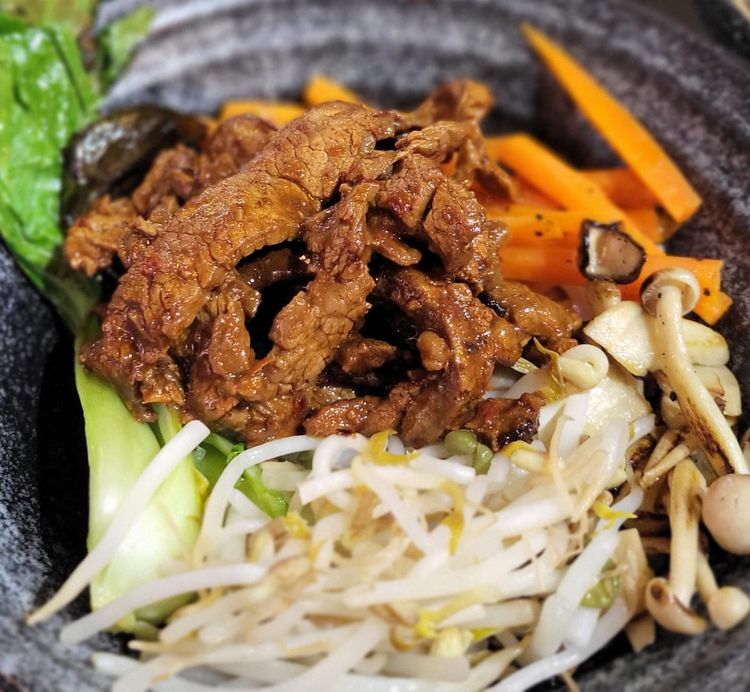 Step 1.1: Get your bowl ready and arrange rice, then colorful veggies, then beef strips