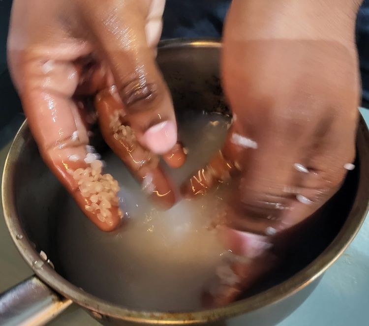 Step 1.1: Place sushi rice in a medium pot and run water over it