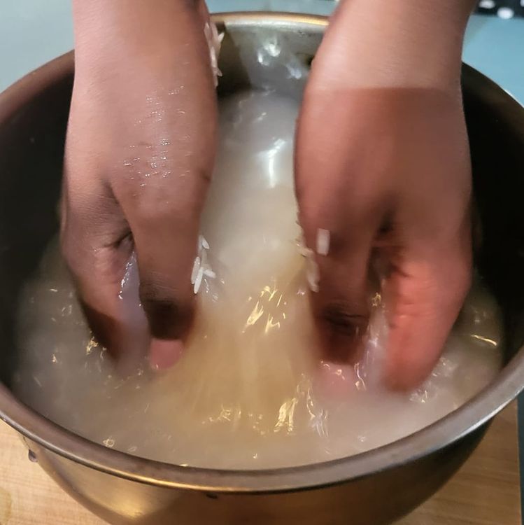 Step 1.1: Wash and rinse the rice in the pot you will be cooking it in until the water runs clear, then strain