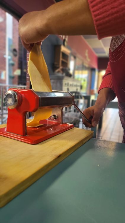 Step 3.1: Take one pasta sheet at a time and feed it through the roller on the wide setting (#5)