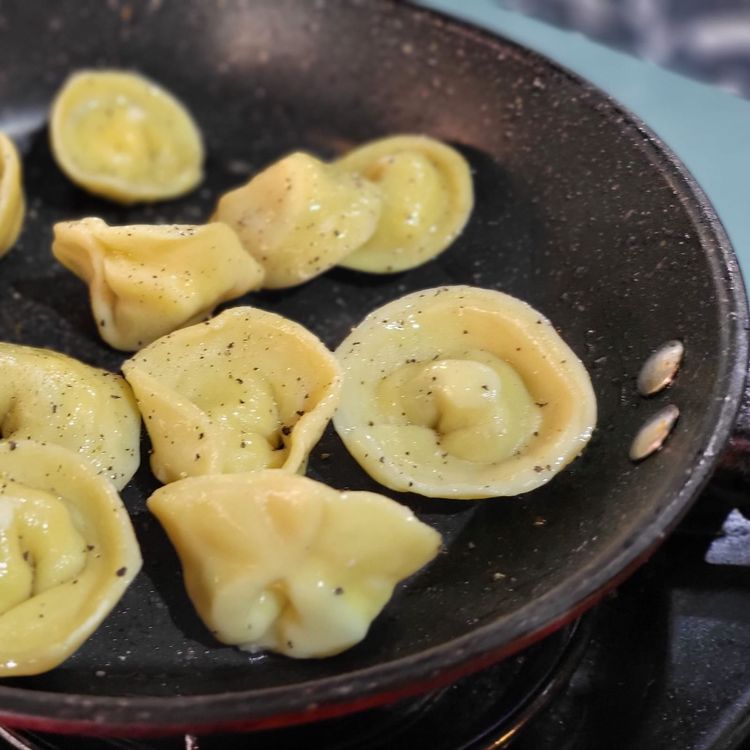 Step 5.1: Heat a pan or wok, add a little olive oil blend, and sauté your tortellinis in batches until they are golden brown