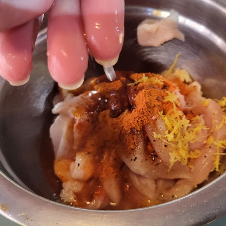 Step 1.1: Place the chicken strips into a bowl and marinate with the lemon juice, zest, garlic, mint, smoked paprika, and half of the olive oil blend