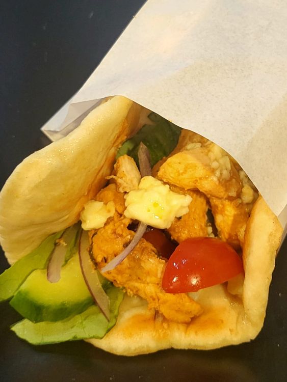 Step 1.1: Roll the filled gyro into a wrap and either wrap it halfway with greaseproof paper to keep it closed in its shape