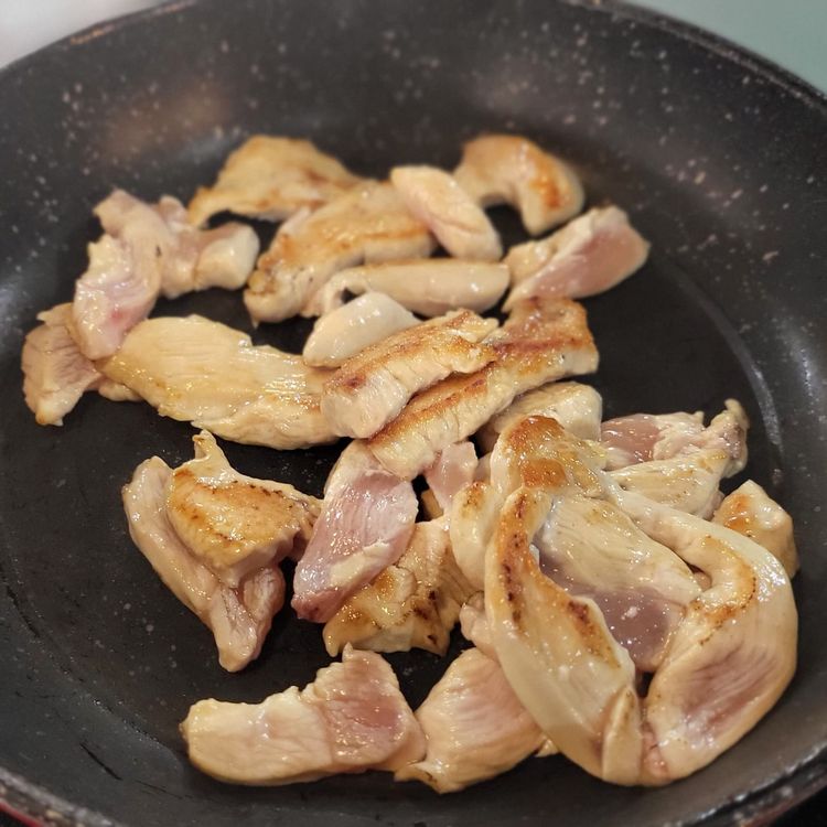 Step 2.1: Heat a pan to high heat, add the vegetable oil, then add the chicken strips