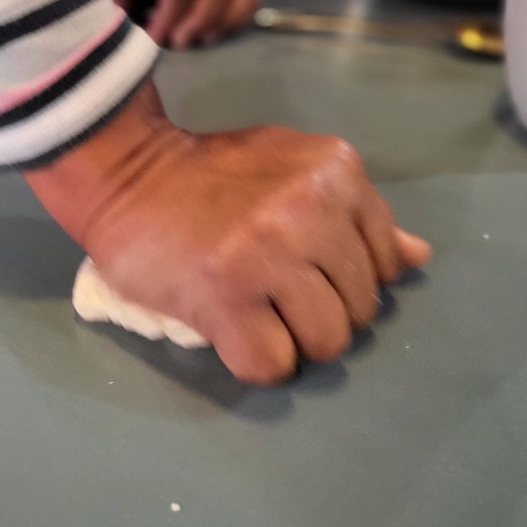 Step 1.2: Place the dough onto a lightly floured surface, then knead with the palms of your hands