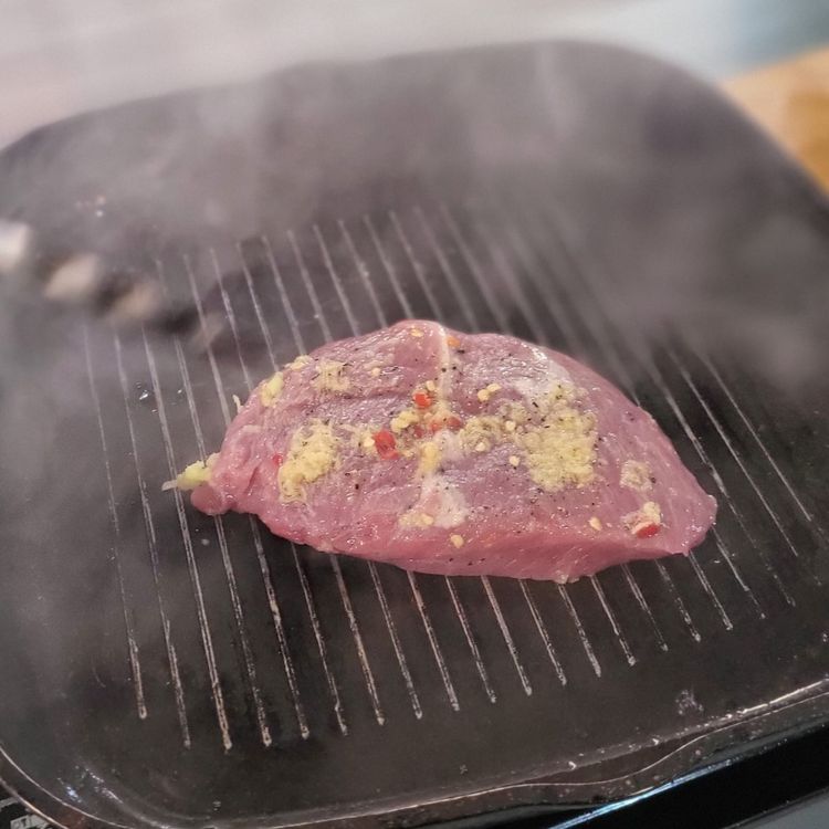 Step 1.2: Heat a griddle pan to smoking hot, add a little olive oil blend, then grill the steak on both sides