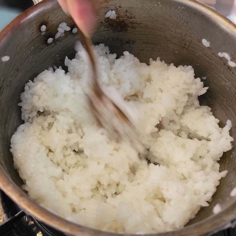 Step 1.2: Place sushi rice in a medium pot and run water over it