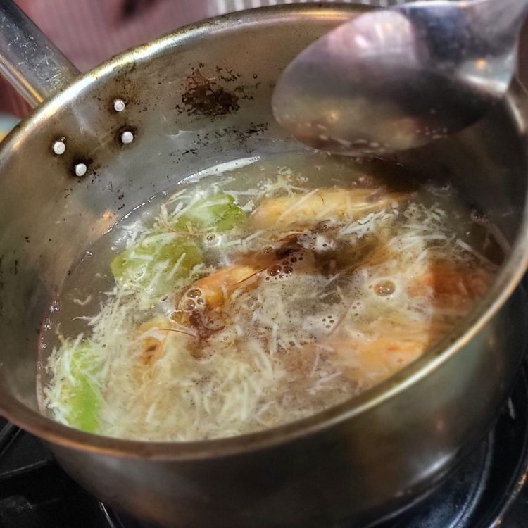 Step 1.1: Prepare the broth: Bring chicken stock to boil in a medium pot, add the prawn shells and heads