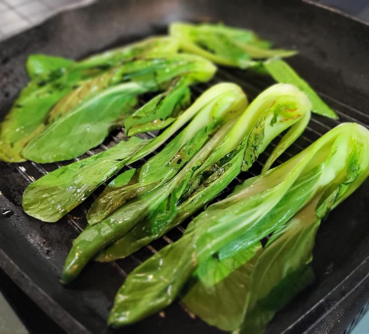 Step 1.1: Heat a griddle pan, add a little sesame oil, and grill the pak choi halves until slightly brown on all sides, then remove from the pan