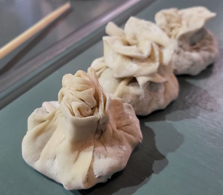 Step 3.2: Fill each dough wrapper by placing some of the beef mince filling, topped with a cube of the jelly