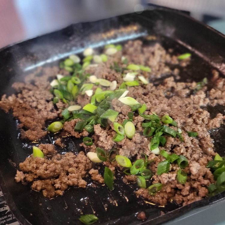 Step 1.1: Heat a pan, add sesame oil, and brown the beef mince