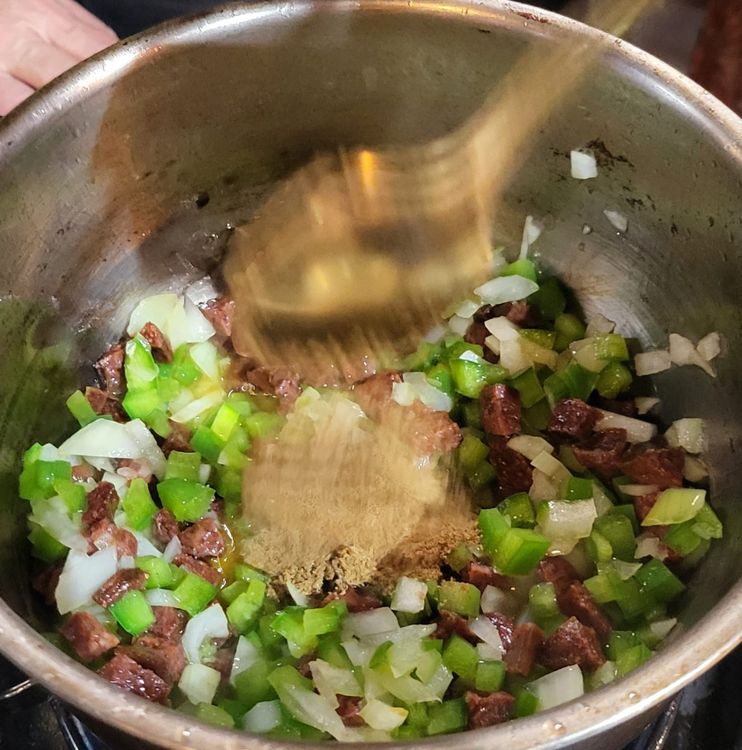 Step 1.1: Heat a medium pot, add the olive oil blend, then add the chorizo sausage & cook over medium to low heat until the oil starts to turn an orange colour