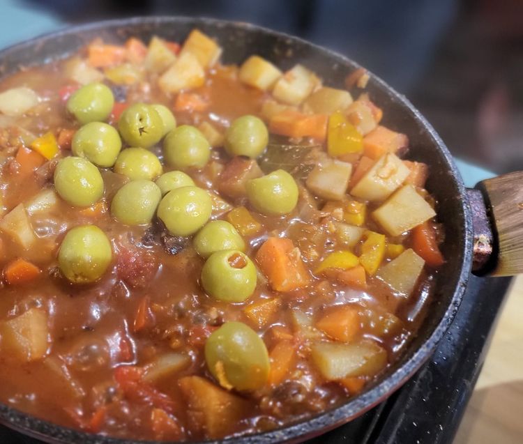 Step 1.1: Add the pimento stuffed olives, mix well, then simmer for another 5 min