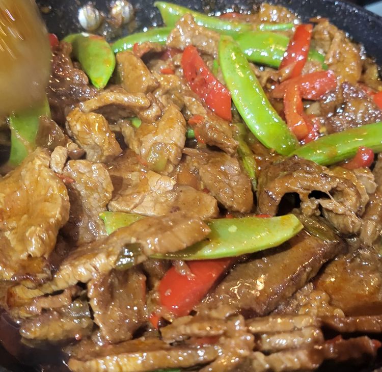 Step 1.1: Add the sugar snaps to the beef curry and mix through, then serve with fluffy basmati rice and pickled carrot cucumber salad