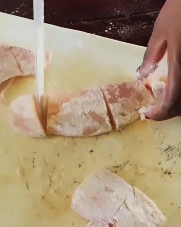 Step 1.1: Cut the tilapia fillets into pieces and toss them in cornstarch to create a thin coating