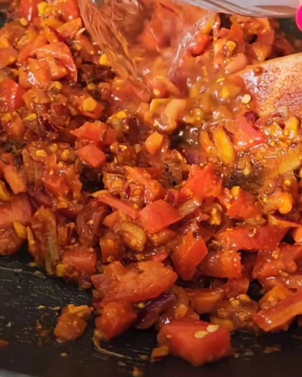 Step 2.1: Toss in the chopped tomatoes and stir to combine