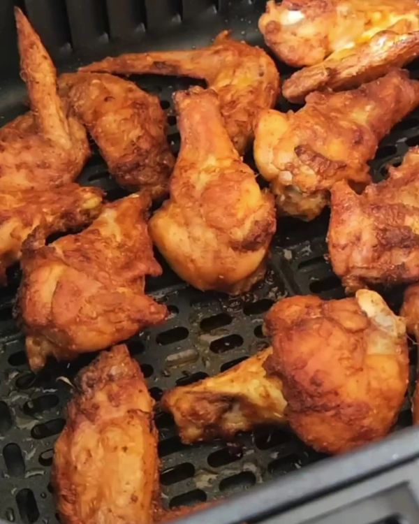 Step 2.1: Place the crispy wings in a large bowl and pour the honey lemon glaze over them