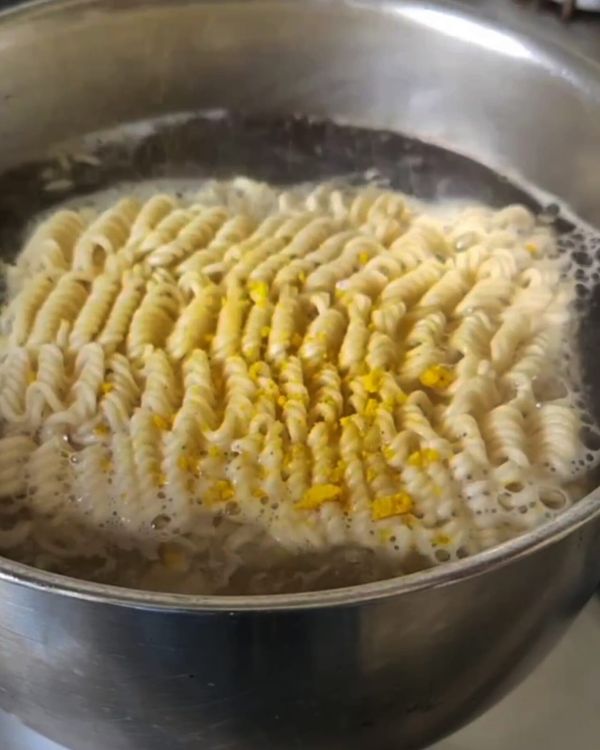 Step 1.1: Bring a pot of water to a boil and add the Noodies noodles along with their chicken flavor seasoning packets