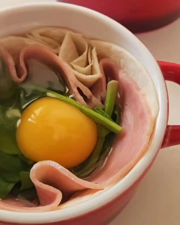 Step 1.1: Crack an egg over the ingredients and season with salt and pepper