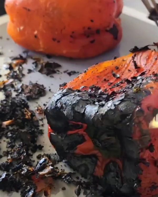 Step 1.1: Allow the peppers to cool, then peel off the charred skin