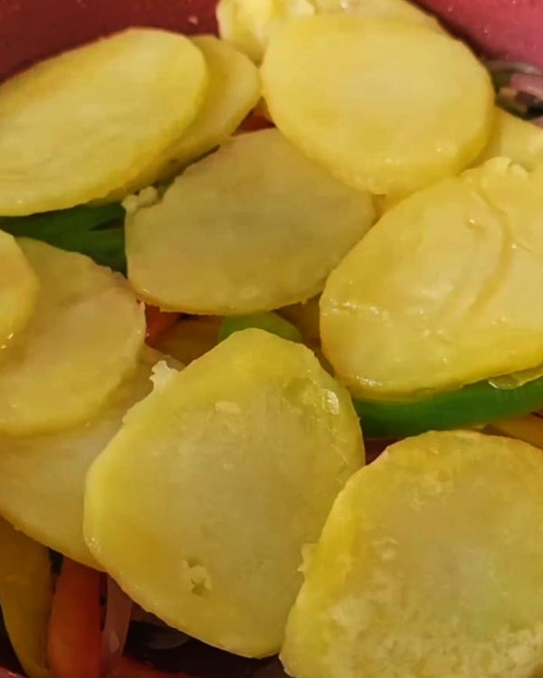 Step 2.1: layer cooked potatoes and vegetables