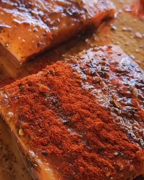 Step 1.2: Pat the salmon fillets dry and rub generously with smoked paprika, herb mustard seasoning, dried fireball peppers, and salt