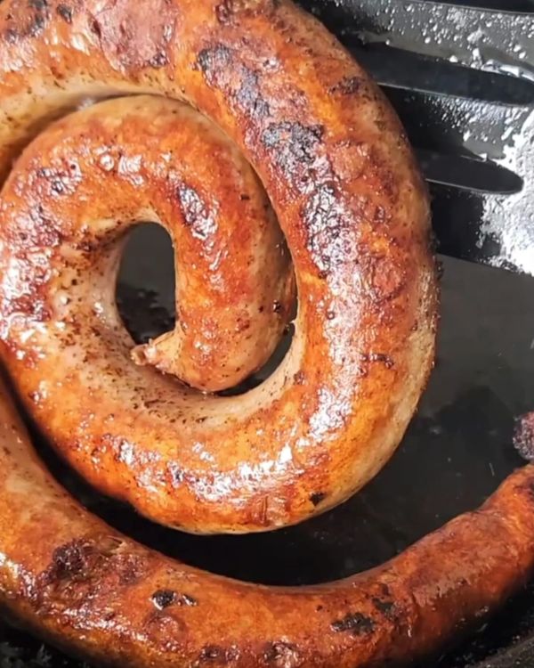 Step 2.1: Place the boerewors in the pan and cook for about 10-12 minutes, turning occasionally, until browned and cooked through