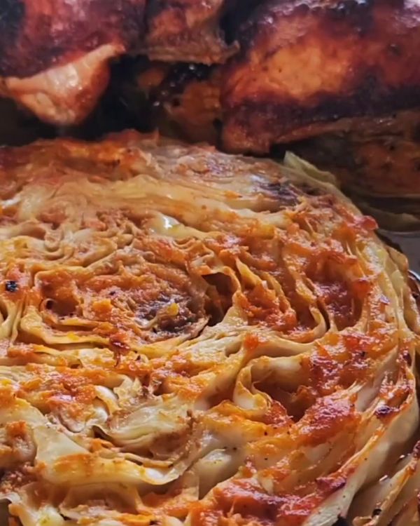 Step 4.1: Place the tray in the preheated oven and roast for about 25 minutes, or until the cabbage is tender and slightly charred at the edges, and the chicken is golden brown and cooked through