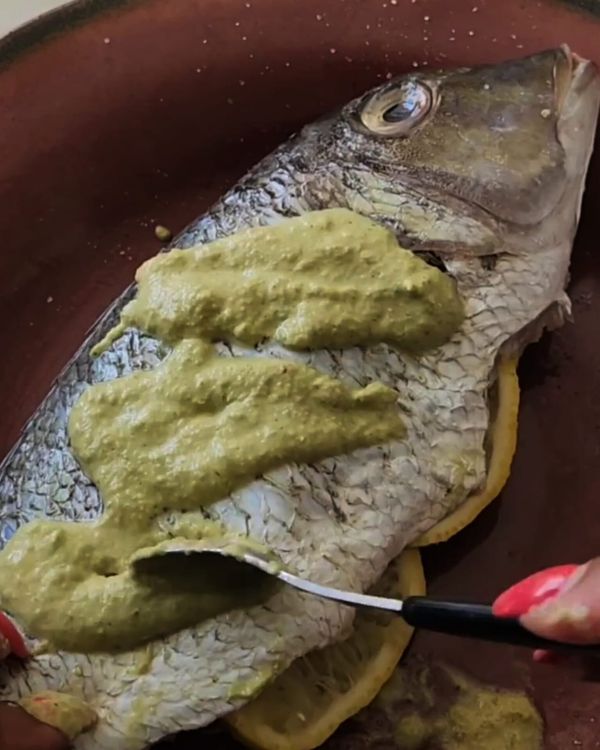 Step 1.1: Rub the cilantro-ginger marinade all over the fish, making sure to get it into the scored cuts and the cavity