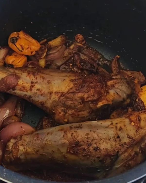 Step 2.1: Return the lamb shanks to the pot and add the crushed tomatoes, red wine, balsamic vinegar, and stock