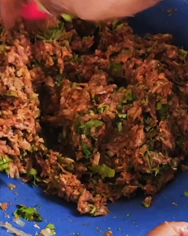 Step 1.1: In a mixing bowl, combine lamb mince, egg yolks, breadcrumbs, grated onion, cumin powder, paprika, salt, and chopped coriander