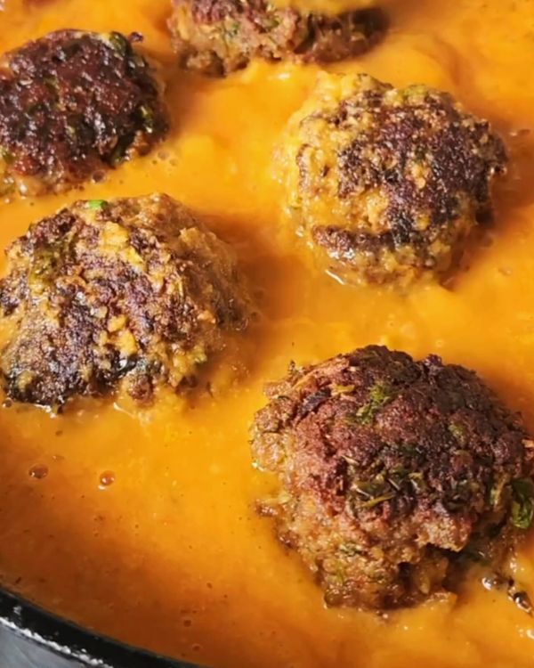 Step 2.1: Gently place the meatballs in the sauce and spoon the sauce over them to coat