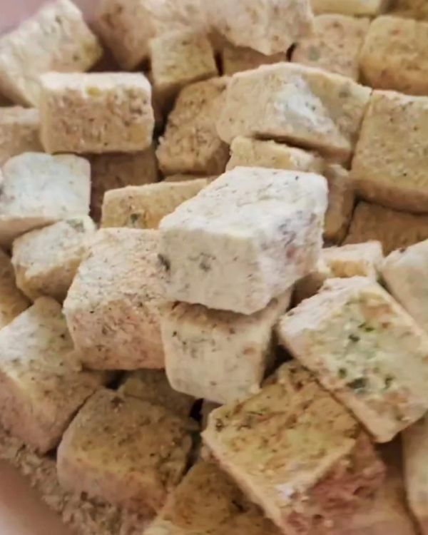 Step 1.1: Toss the tofu pieces in cornstarch, salt, and black pepper, ensuring each piece is coated evenly