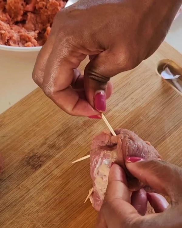 Step 3.1: Carefully roll each beef slice around the filling, tucking in the sides as you go to secure the filling inside