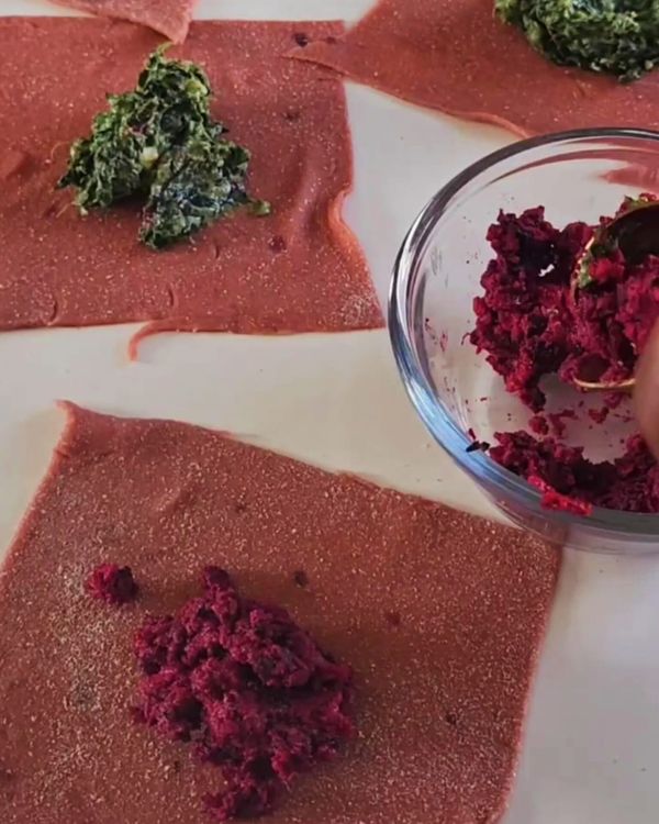 Step 3.1: Spoon filling into the center of each square with spinach and beet (leftover) and fold into parcels