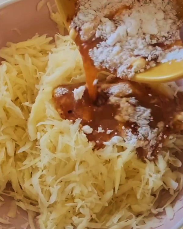 Step 2.1: Combine the eggs with the grated potato mixture, ensuring it's evenly mixed