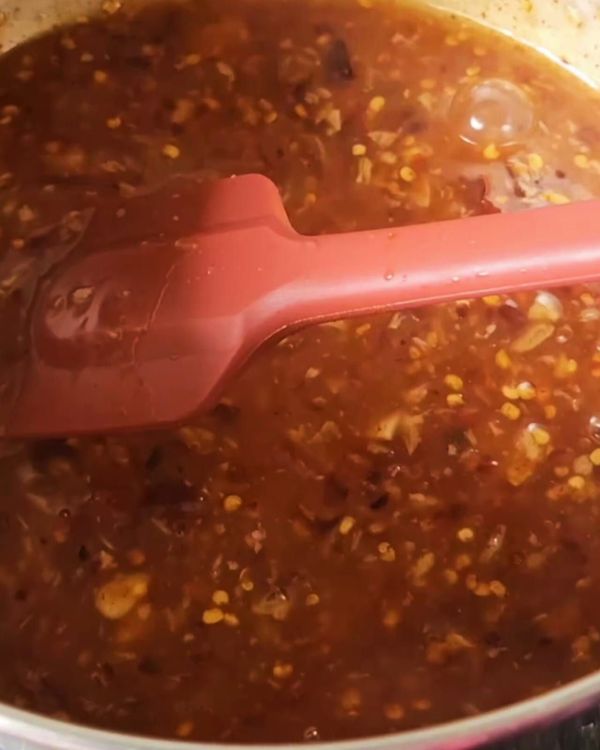 Step 3.1: Slowly pour in the cornstarch mixture, stirring constantly to avoid lumps