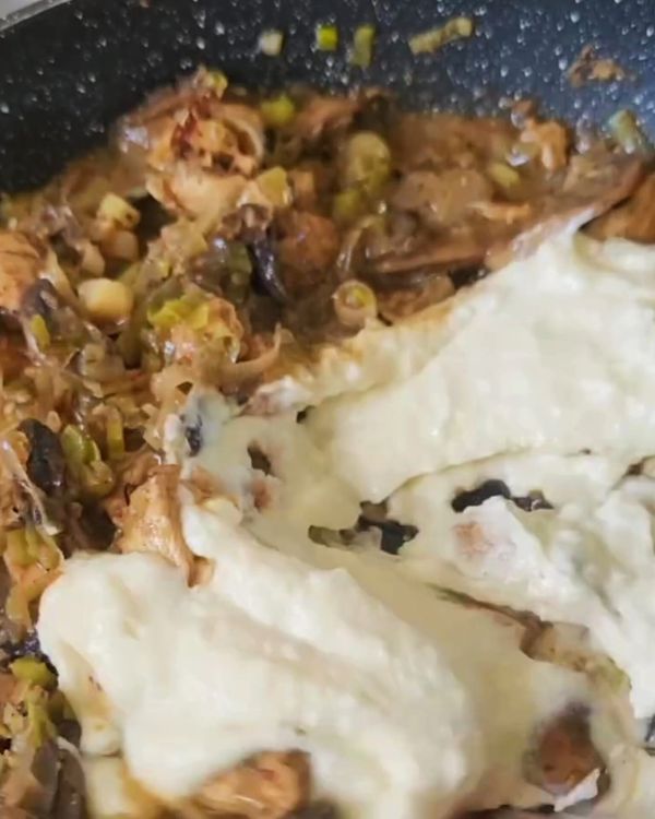 Step 2.1: Stir the bechamel sauce, cream cheese, and beaten eggs into the chicken, mushroom, and leek mixture, mixing until well combined