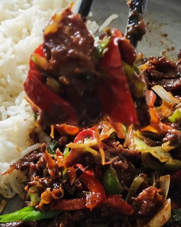 Step 5.1: Transfer the stir fry to a plate and serve hot with steamed rice or noodles