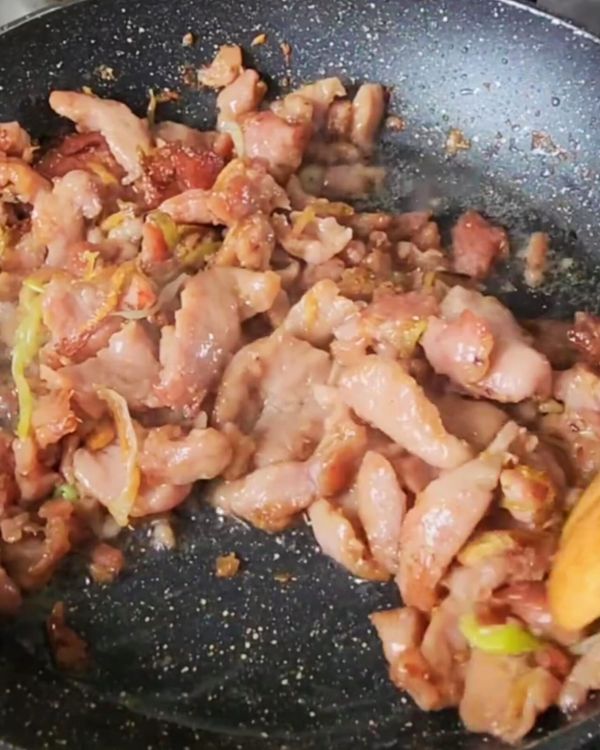 Step 4.1: Add the marinated pork to the wok and stir-fry for 2-3 minutes until it’s no longer pink and starting to brown
