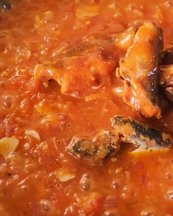 Step 3.1: Add the sardines along with their tomato sauce to the skillet
