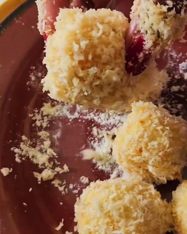 Step 3.1: Roll each potato ball in the flour, ensuring it's evenly coated