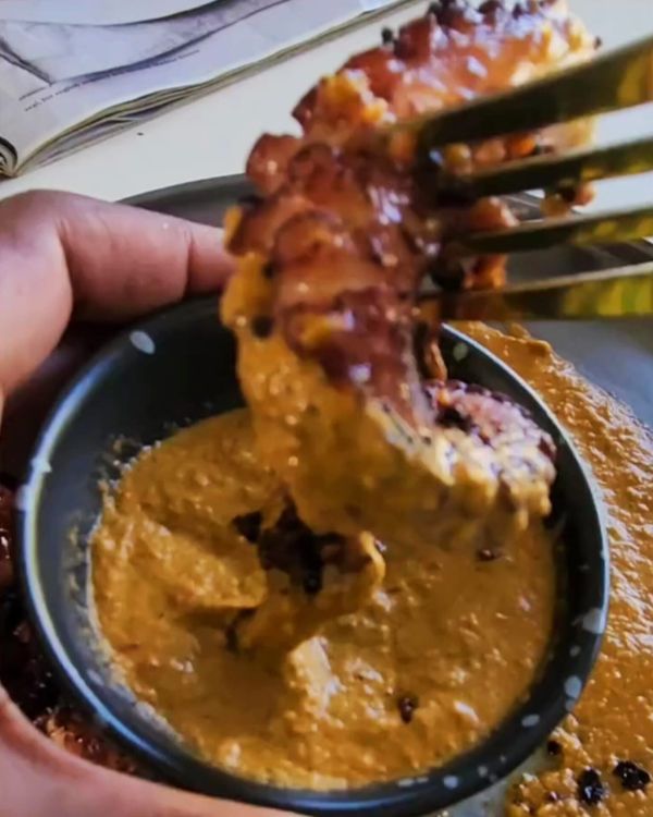 Step 3.1: Plate the charred octopus with a generous dollop of chili lime romesco sauce