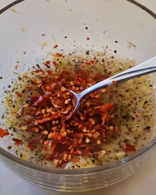 Step 1.1: In a bowl, mix the olive oil, minced garlic, paprika, chili powder, ground cumin, salt, and pepper to create a spicy garlic marinade