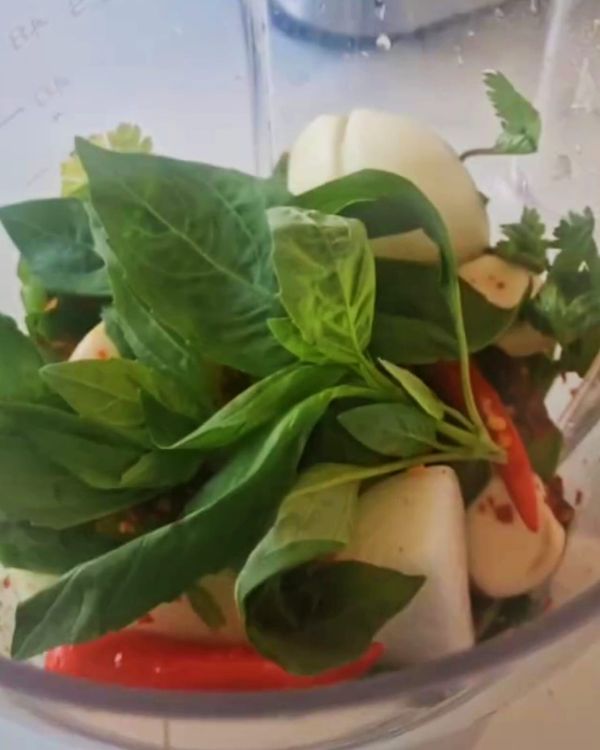 Step 1.1: Add the basil, coriander, green pepper, garlic, yellow onions, spring onion, lemon juice, vinegar, sunflower oil, Serrano peppers, salt, and pepper to a blender