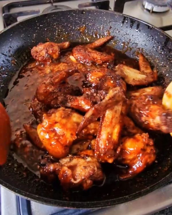Step 3.1: Toss the cooked wings in the sriracha honey glaze until well coated