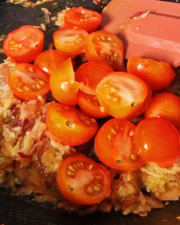 Step 2.1: Stir in tomatoes, grated coconut, coriander, and salt