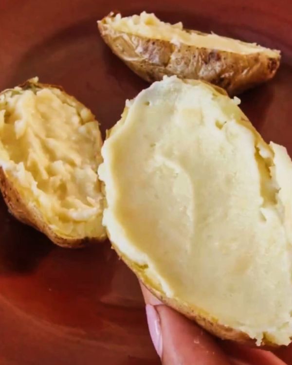 Step 3.1: Spoon the mashed mixture back into the potato shells